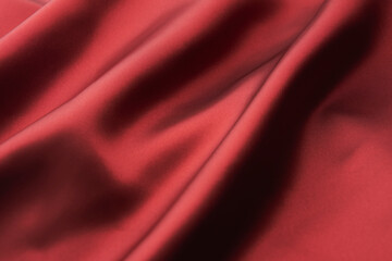 Naklejka na ściany i meble 少し光沢のある綺麗な赤いサテン布のドレープ