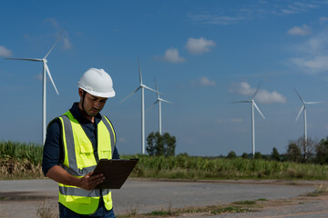 person with wind turbine in the field. engineer with turbine in the wind. engineer with turbine