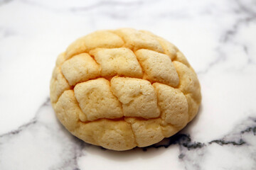 Melon bread, a sweet dessert bread that is a staple of Japan on the table