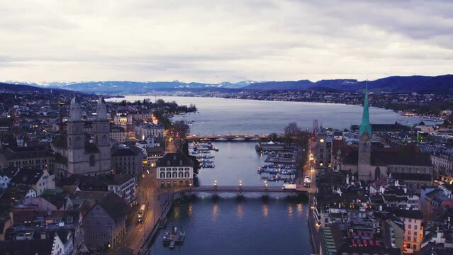 Aerial drone shot flying above Lake Zurich, Switzerland in sunny day.	