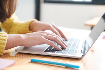 Close up hands using computer laptop mockup.