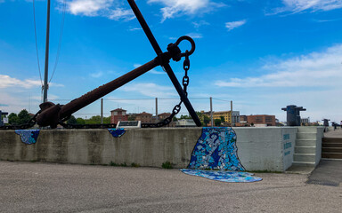 Beutiful buildings reflection on Ravenna's darsena on a morning sunny day . a dock is an enclosed...