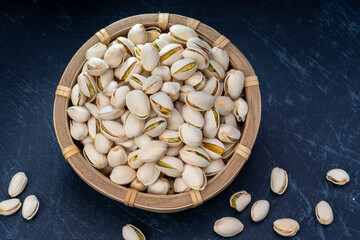 Pistachio Nut, Whole Shelled on wooden background.
