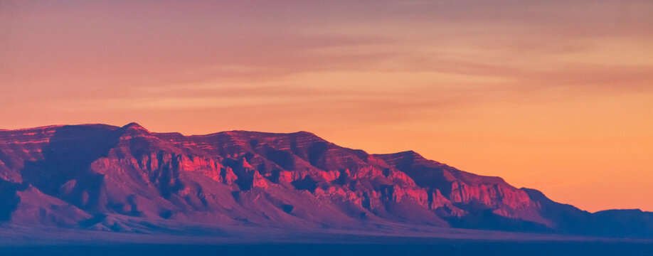 Fiery sunset illuminating the rocky mountains in New Mexico