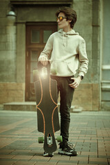 active teenager with longboard