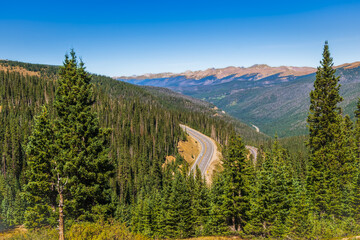 View of mountain road through Rocky Mountain National Park, Colorado, USA, from continental divide...