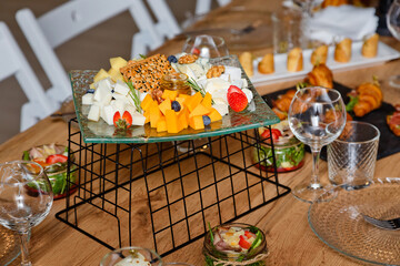 Appetizers table with differents antipasti, charcuterie, snacks and cheese. Buffet party. Top view, copy space, negative space