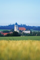 Summer panoramic view of czech (Souht Bohemia) landscape with town Dacice (Dačice), fields, hills, meadow and path during sunset and mist, noise