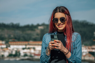 pretty girl with mobile phone in the street