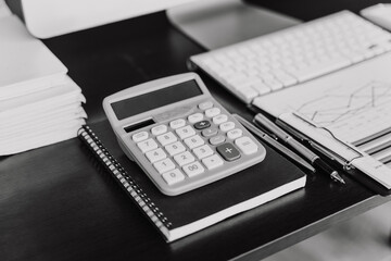 Nobody, Office supply on desk table with analysis chart, computer, notebook, pen,calculator on desk, Business concept.