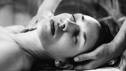 Cranial Osteopathy. Therapist Massaging Woman’s Head.