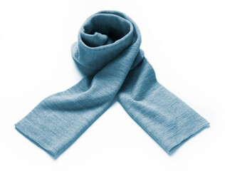 light blue scarf in soft wool rolled up on a white background
