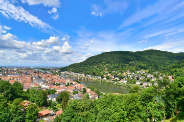 Fototapeta na wymiar View over old town in Heidelberg in Germany with Neckar river and Heiligenberg hill
