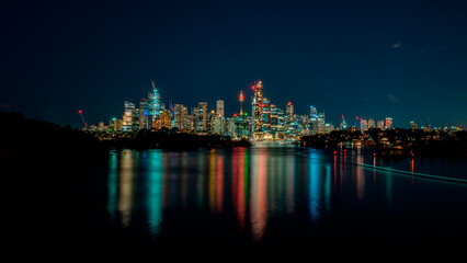 Fototapeta na wymiar Wide and colorful view of Sydney cityscape at night.