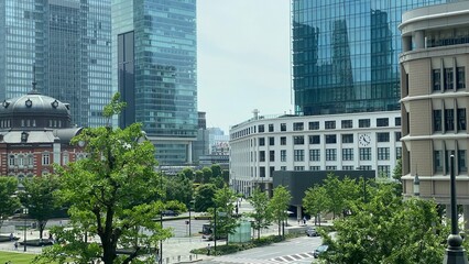 Street view of Tokyo station from above, bird view of the station and the crossings with Marunouchi / KITTE, high-rise skyscrapers, year 2022 June 19th, Japan