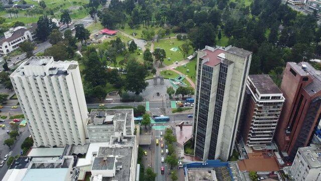 Quito, Ecuador: Aerial drone footage of the La Mariscal business and downtown district in Quito and the El Ejido park, Ecuador capital city in the Andes in South America