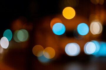Bokeh traffic light at night in the street of a big city for background
