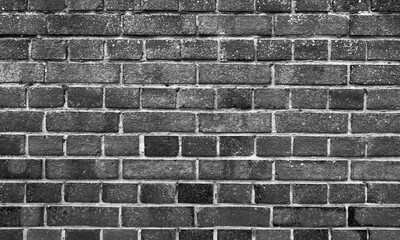 Old black brick wall, detailed grungy background texture