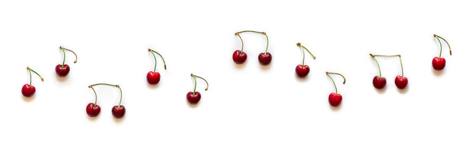 on white background notes from berries sweet cherry red color place inscription music notation camp copy space banner