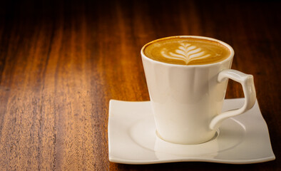 cup of coffee on wooden table