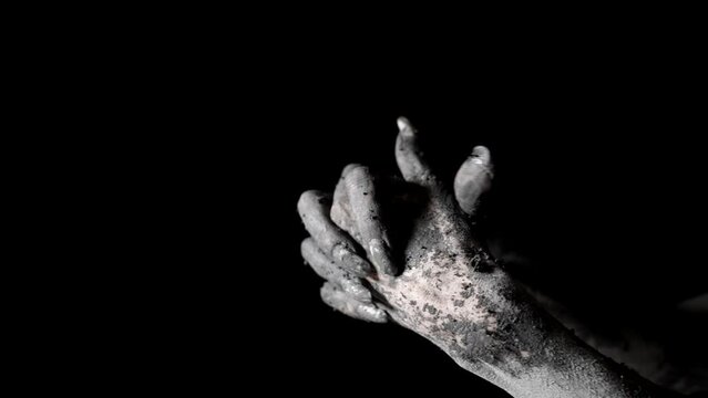 close-up of a female's hands smeared with clay. black and white video