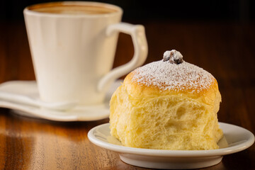 sweet bread stuffed with chocolate and a cup of coffee