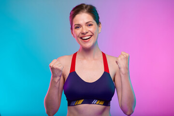 Fototapeta na wymiar Power muscle concept with sporty woman in fitness sportswear flexes her arm. Female fitness portrait isolated on neon multicolor background.