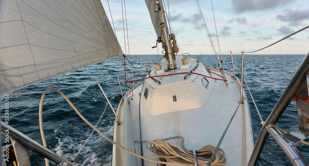 Poster Yacht deck, mast, sail. Top down (high angle) view. Sea, waves and water splashes. clear blue sky. Transportation, nautical vessel, cruise, sport, regatta, recreation, leisure activity, yachting