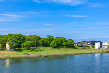 Fototapeta na wymiar ABASHIRI, JAPAN - JUN 2, 2022: View of the Abashiri River in Abashiri City, Hokkaido, Japan.