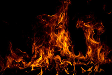 Fire flames isolated on black background. Fire burn flame isolated, flaming burning art design concept with space for text.