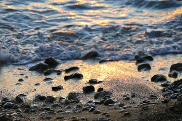 Sand and sea on the beach in sunset