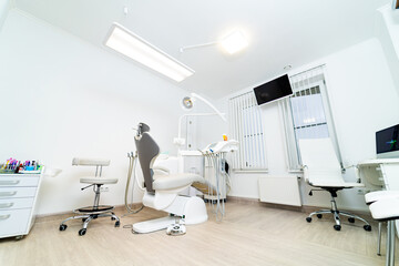 Modern white dentistry cabinet. Clinical stomatology interior room.