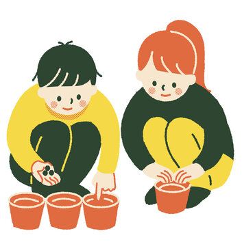 鉢に種を植える児童