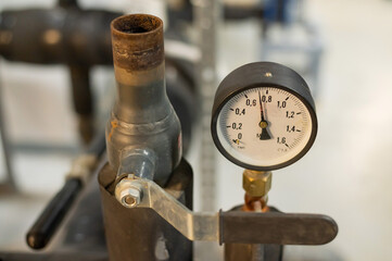 Pressure sensors in the urban heating system. Hot water pipes in an industrial boiler room. 