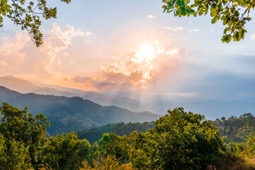 Mountain valley during sunset or sunrise. Natural spring or summer season landscape