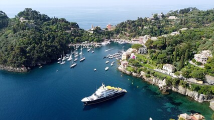 Europe, Italy , Portofino, Liguria - Drone aerial view of Portofino harbor with typical colored...