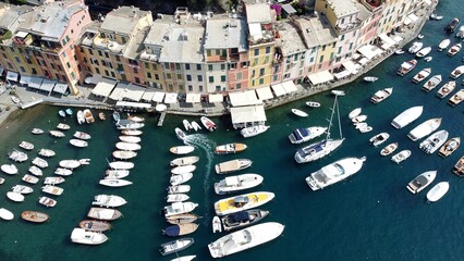 Europe, Italy , Portofino, Liguria - Drone aerial view of Portofino harbor with typical colored...