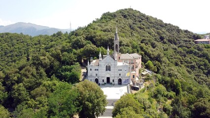 Fototapeta na wymiar Italy, Rapallo, Liguria, Drone aerial view of the Catholic Church sanctuary of Montallegro stands on the top of the mountain overlooking the sea of the bay of Portofino near Genova and Cinque Terre