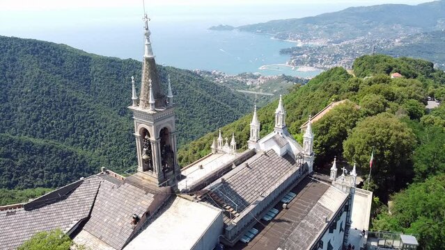Italy, Rapallo, Liguria, Drone aerial view of the Catholic Church sanctuary of Montallegro stands on the top of the  mountain overlooking the sea of the bay of Portofino near Genova and Cinque Terre