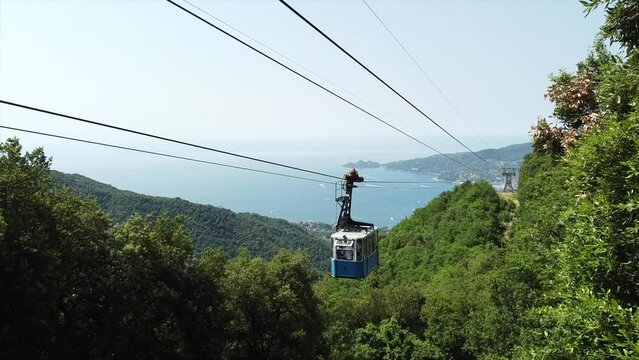 Drone aerial view of cableway ( cable car ) immersed in the green of the mountain with sea view in Monteallegro Rapallo Italy Liguria - Tourist attraction in the summer near Cinque Terre and Portofino