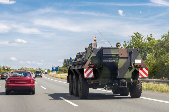 German armoured personnel carrier Fuchs drives military convoy highway road. NATO troops moving reloceation for rapid reaction force reinforcement in eastern Europe