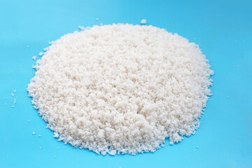 Flower of salt on blue background.