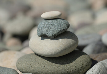 Fototapeta na wymiar Balanced stones background. Stone pyramid. Zen.