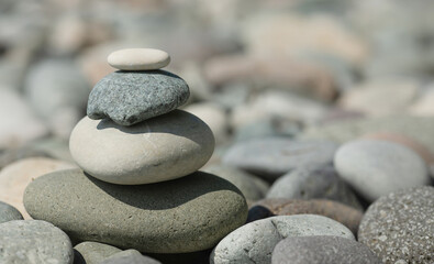 Fototapeta na wymiar Balanced stones background. Stone pyramid. Zen.