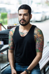 Fototapeta premium Asian Handsome bearded man. Hipster boy with tattoo. Brutal handsome man with tattooed body