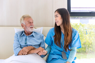 Fototapeta premium Caregiver nurse take care a Senior patient. Nurse helping senior Man