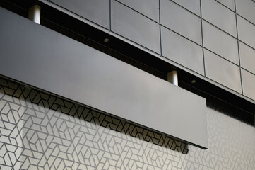 Blank black signboard mock up. Empty signage template in modern bright building interior.