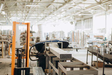 Factory for aluminum and PVC windows and doors production. Details industrial equipment. Background