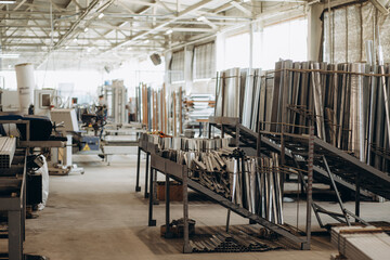 Factory for aluminum and PVC windows and doors production. Details industrial equipment. Background