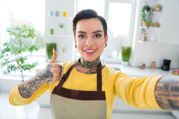 Photo of beautiful girl with piercing and tattoo record video vlog recommend her restaurant work as...